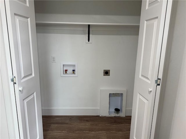 313 Douglas St, Berryville, AR 72616 - washroom featuring electric dryer hookup, dark wood finished floors, baseboards, hookup for a washing machine, and laundry area