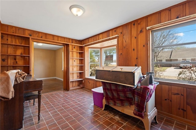 300 Range St, Marshall, AR 72650 - living area featuring built in features, wood walls, and baseboards