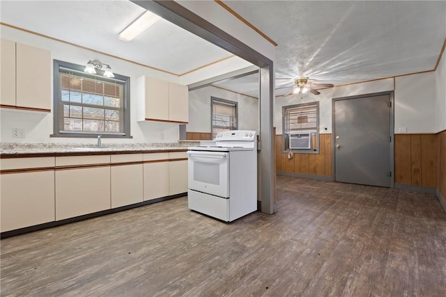 300 Range St, Marshall, AR 72650 - kitchen featuring a sink, cooling unit, wood finished floors, white range with electric stovetop, and ceiling fan