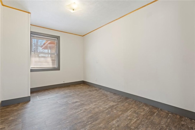 300 Range St, Marshall, AR 72650 - spare room with baseboards, wood finished floors, and ornamental molding