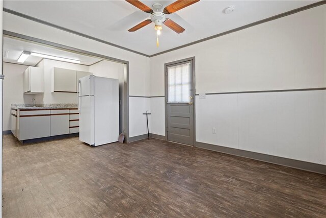 300 Range St, Marshall, AR 72650 - interior space featuring dark wood-type flooring, ornamental molding, and a ceiling fan