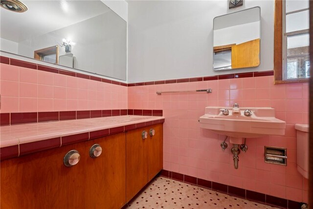 300 Range St, Marshall, AR 72650 - bathroom with tile walls, a wainscoted wall, and tile patterned floors