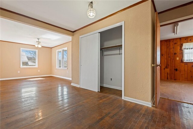 300 Range St, Marshall, AR 72650 - unfurnished bedroom with hardwood / wood-style floors, a closet, ornamental molding, and baseboards