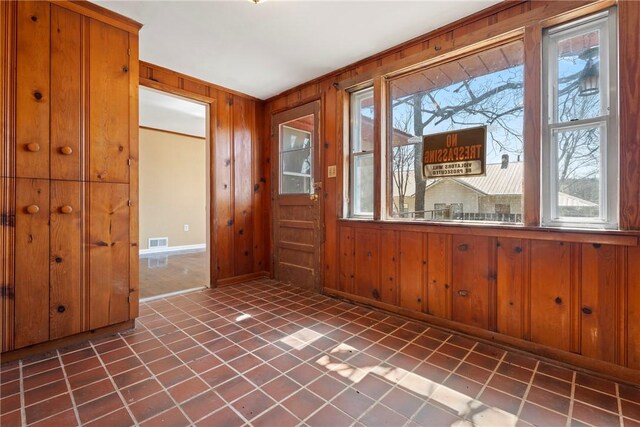 300 Range St, Marshall, AR 72650 - foyer entrance with baseboards, visible vents, and wood walls