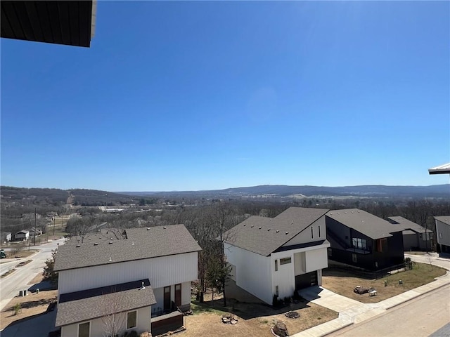 view of mountain background with nearby suburban area