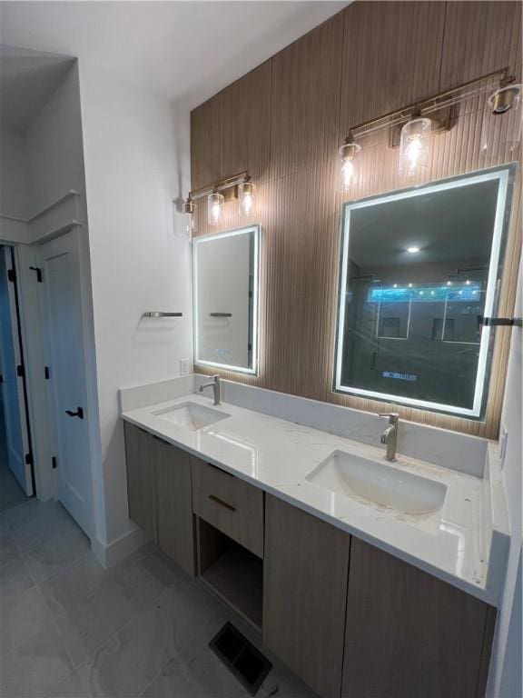111 S Paddock Loop, Fayetteville, AR 72701 - bathroom with double vanity, baseboards, and marble finish floors