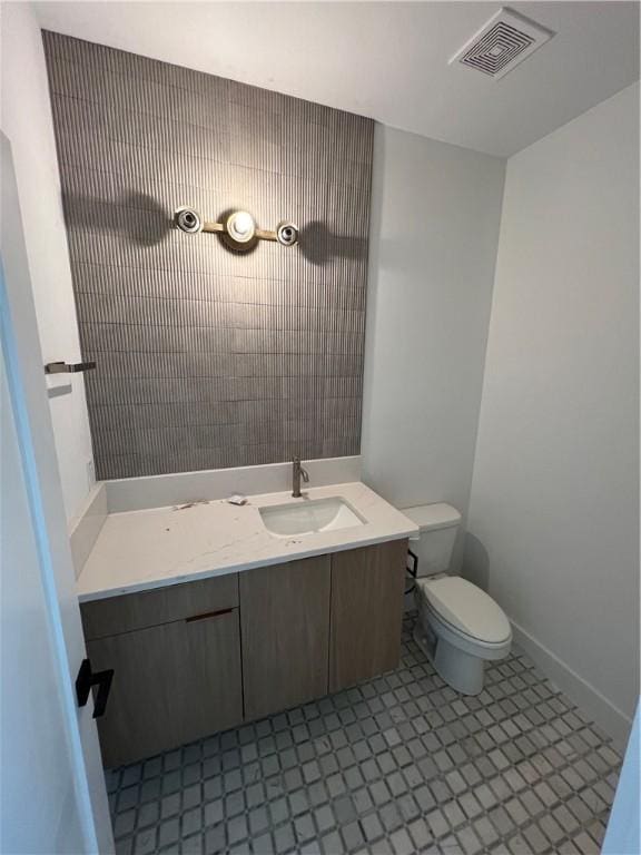 111 S Paddock Loop, Fayetteville, AR 72701 - bathroom with vanity, toilet, and baseboards