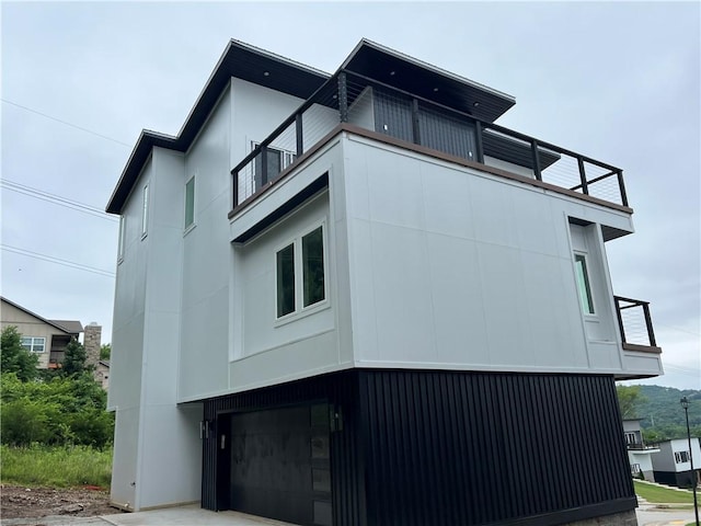 111 S Paddock Loop, Fayetteville, AR 72701 - view of side of home with a balcony and a garage