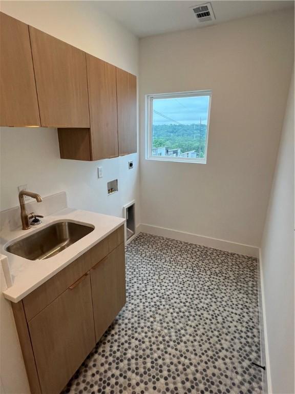 111 S Paddock Loop, Fayetteville, AR 72701 - washroom with electric dryer hookup, cabinet space, hookup for a washing machine, and baseboards