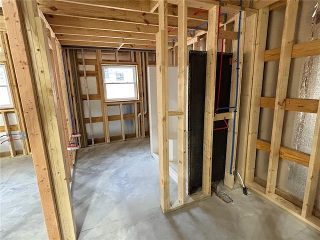 misc room with unfinished concrete floors
