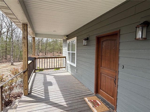 wooden terrace with a porch