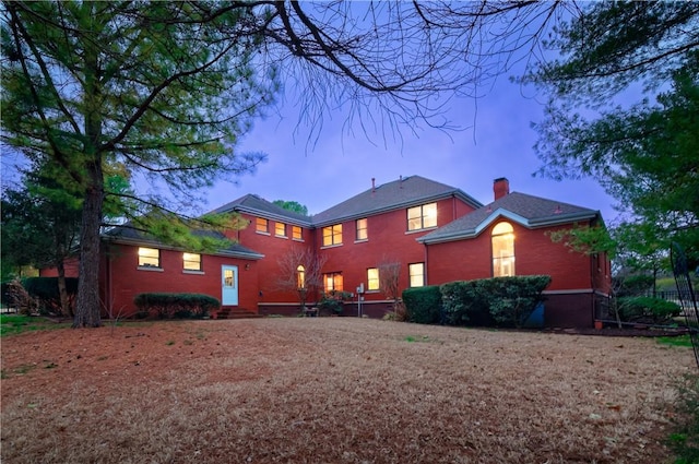 2356 N Primrose Ln, Fayetteville, AR 72703 - view of front of home with a chimney, brick siding, and entry steps