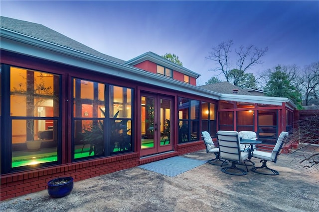 2356 N Primrose Ln, Fayetteville, AR 72703 - view of patio / terrace with a sunroom, outdoor dining space, and french doors