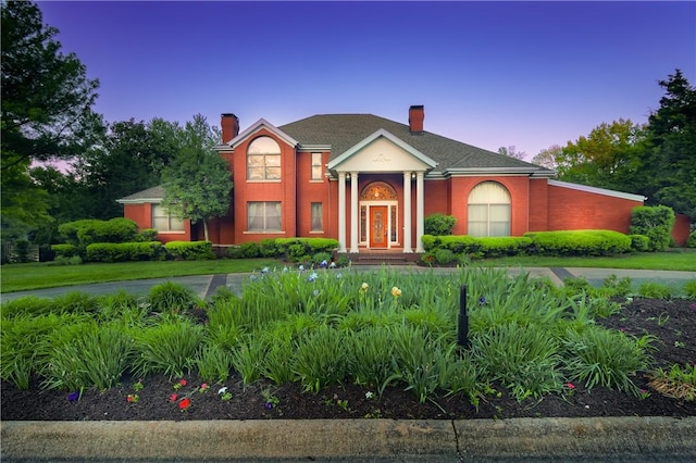 2356 N Primrose Ln, Fayetteville, AR 72703 - neoclassical home with a chimney and a front lawn