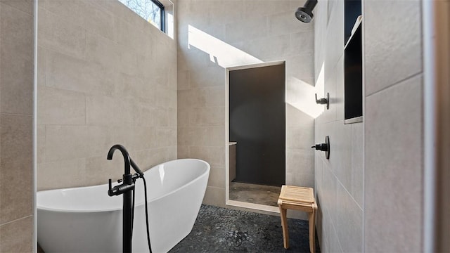 122 SW Gailey Hollow Rd, Siloam Springs, AR 72761 - bathroom featuring walk in shower, tile walls, and a freestanding tub