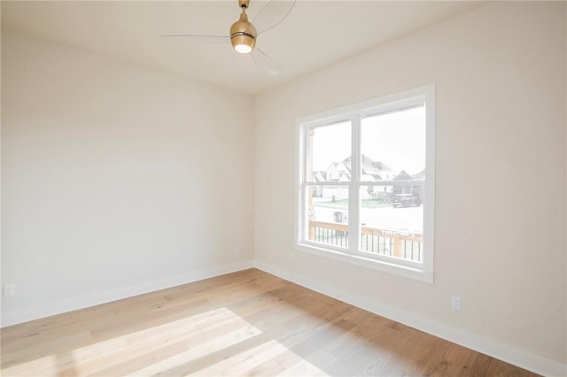 5914 SW Bloomsbury Rd, Bentonville, AR 72713 - spare room with healthy amount of natural light, wood finished floors, baseboards, and ceiling fan