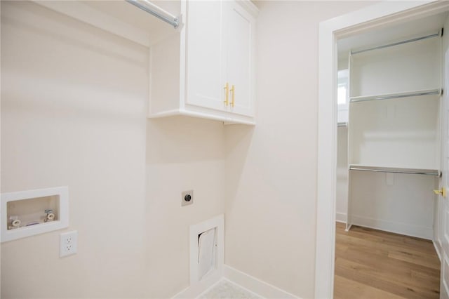 5914 SW Bloomsbury Rd, Bentonville, AR 72713 - laundry area with cabinet space, electric dryer hookup, hookup for a washing machine, light wood-style floors, and baseboards