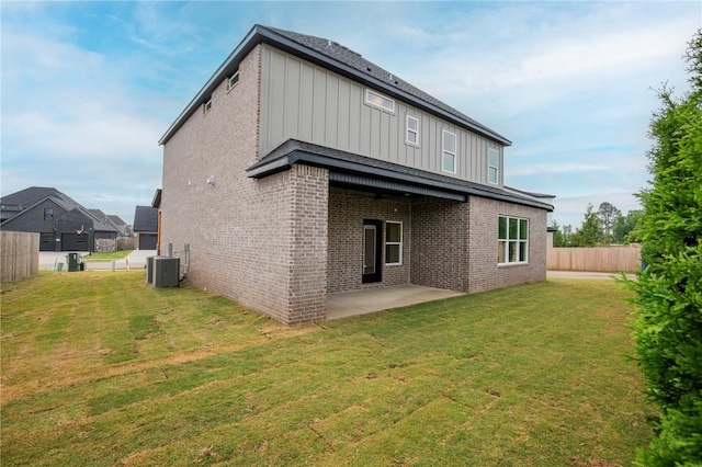 5914 SW Bloomsbury Rd, Bentonville, AR 72713 - rear view of house with board and batten siding, brick siding, a patio area, and central AC