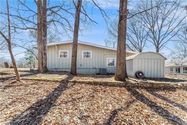 12 Ipswich Dr, Bella Vista, AR 72714 - view of side of property featuring board and batten siding and a central AC unit