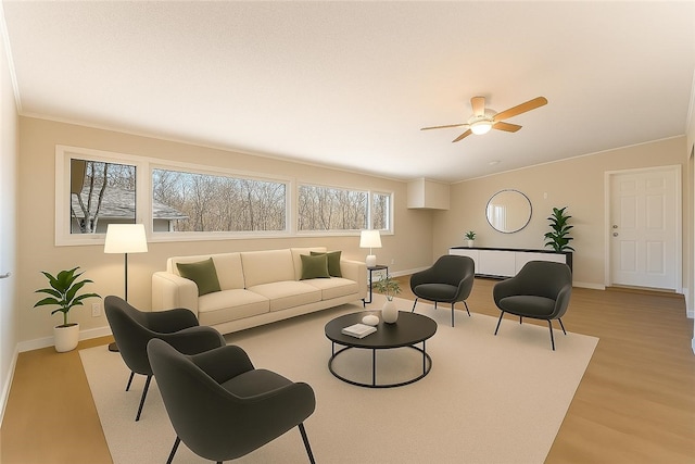12 Ipswich Dr, Bella Vista, AR 72714 - living room featuring light wood-type flooring, a ceiling fan, and lofted ceiling