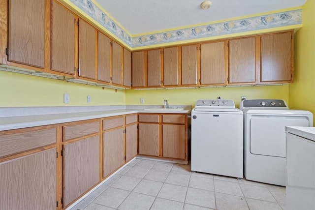 14745 Russell Rd, Siloam Springs, AR 72761 - clothes washing area featuring light tile patterned floors, washer and clothes dryer, a sink, and cabinet space