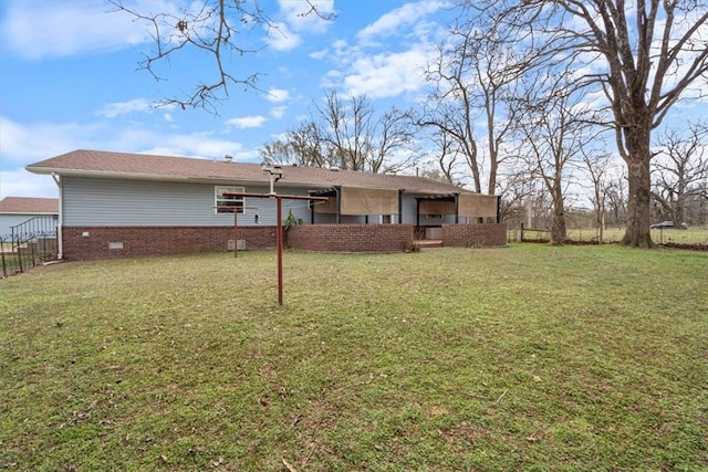 14745 Russell Rd, Siloam Springs, AR 72761 - back of property with crawl space, a yard, and fence