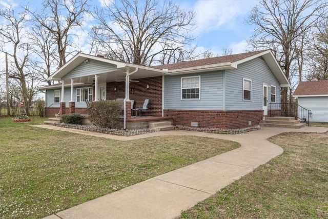 14745 Russell Rd, Siloam Springs, AR 72761 - view of front of property featuring brick siding, crawl space, a front lawn, and covered porch