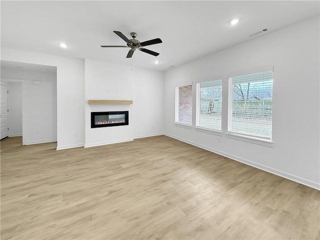 575 W Canada Dr, Farmington, AR 72730 - unfurnished living room with a ceiling fan, baseboards, visible vents, and recessed lighting