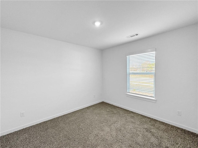 575 W Canada Dr, Farmington, AR 72730 - empty room with visible vents, baseboards, and dark carpet