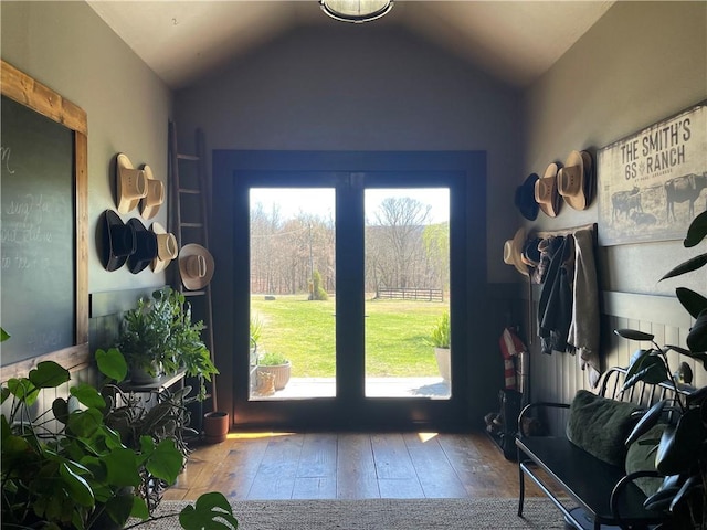 entryway with plenty of natural light, hardwood / wood-style flooring, and lofted ceiling