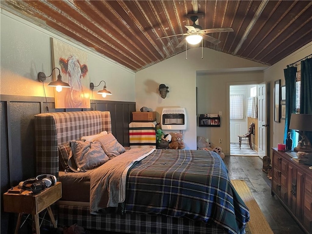 bedroom featuring wooden ceiling, hardwood / wood-style floors, heating unit, and lofted ceiling