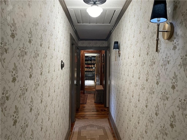 corridor with wallpapered walls and crown molding