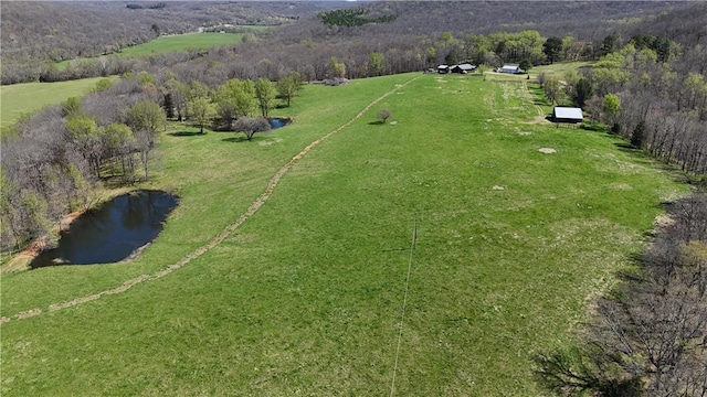 aerial view featuring a water view and a rural view