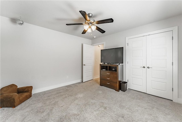 2208 N Carl St, Siloam Springs, AR 72761 - carpeted bedroom with ceiling fan, baseboards, and a closet