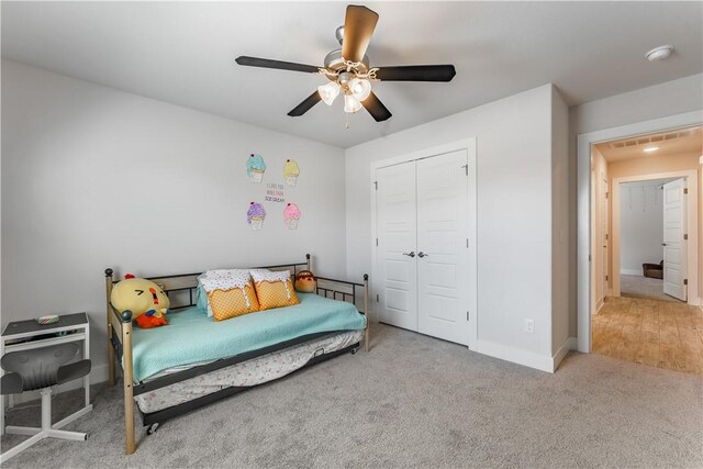 2208 N Carl St, Siloam Springs, AR 72761 - bedroom featuring a closet, carpet, baseboards, visible vents, and a ceiling fan