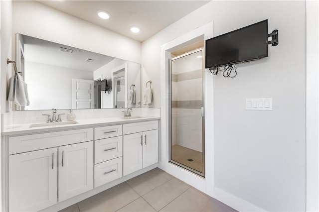 2208 N Carl St, Siloam Springs, AR 72761 - full bath with double vanity, a sink, a shower stall, and tile patterned floors