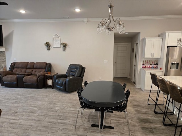2208 N Carl St, Siloam Springs, AR 72761 - interior space with visible vents, wood finished floors, an inviting chandelier, and ornamental molding
