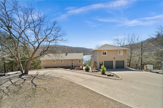 21621 Vista Shores Dr, Garfield, AR 72732 - view of front facade featuring an attached garage and driveway