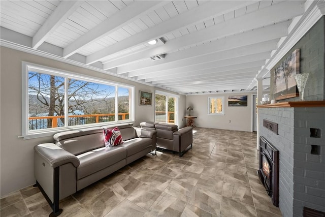 21621 Vista Shores Dr, Garfield, AR 72732 - living area featuring beamed ceiling, a fireplace, and visible vents
