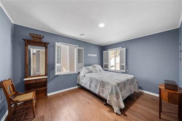 21621 Vista Shores Dr, Garfield, AR 72732 - bedroom with visible vents, baseboards, and hardwood / wood-style flooring