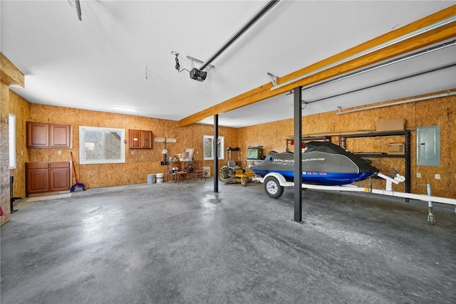 21621 Vista Shores Dr, Garfield, AR 72732 - garage featuring electric panel and a garage door opener