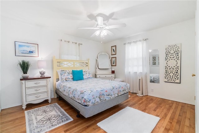 10230 S Marango Dr, Rogers, AR 72758 - bedroom featuring wood finished floors, baseboards, and ceiling fan