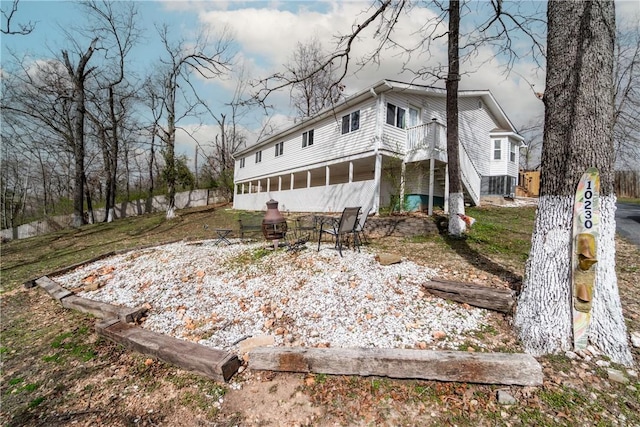 10230 S Marango Dr, Rogers, AR 72758 - back of property with a sunroom, fence, and stairway