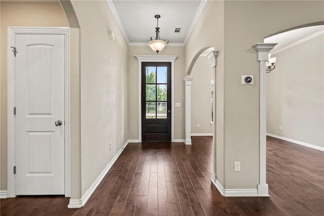 foyer with arched walkways, dark wood finished floors, and visible vents