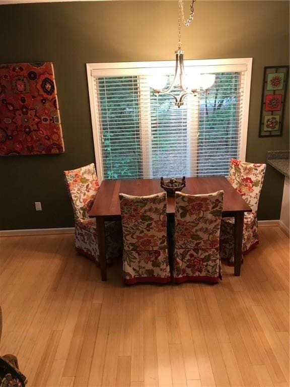 258B Vista, Mount Ida, AR 71957 - dining space with baseboards, an inviting chandelier, and wood finished floors