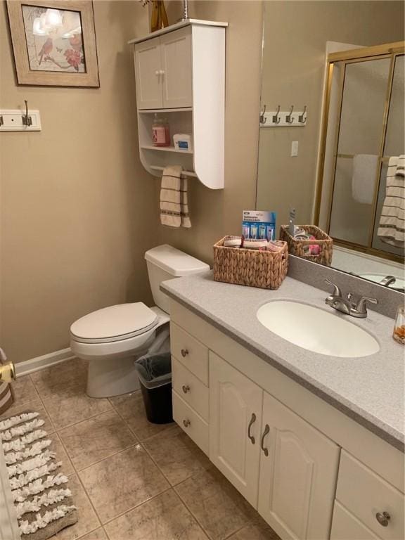 258B Vista, Mount Ida, AR 71957 - full bathroom with toilet, a shower stall, tile patterned flooring, baseboards, and vanity