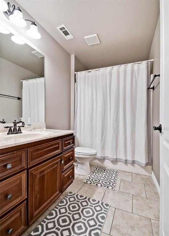 full bathroom with tile patterned floors, visible vents, toilet, and vanity