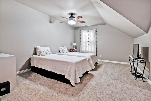 carpeted bedroom featuring baseboards, lofted ceiling, and a ceiling fan
