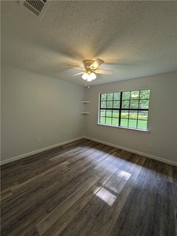 116 Stegall Rd, Clarksville, AR 72830 - unfurnished room featuring ceiling fan, a textured ceiling, and dark wood-type flooring