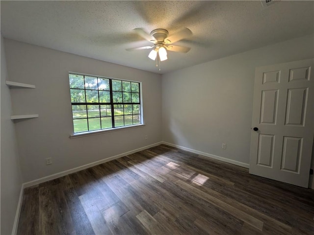 116 Stegall Rd, Clarksville, AR 72830 - empty room with a ceiling fan, dark wood-type flooring, and a textured ceiling